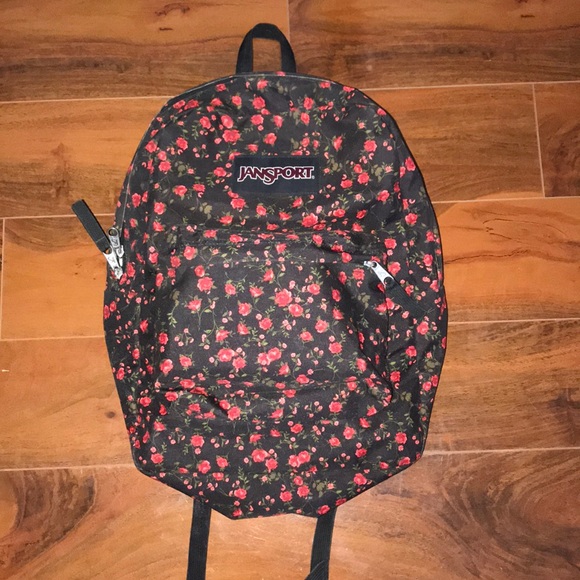 black jansport backpack with red roses